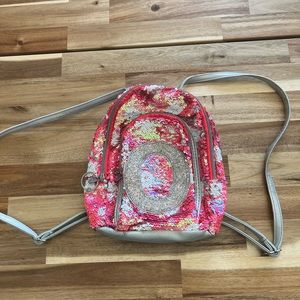 Justice “O” flippie sequins mini backpack in used‎ condition